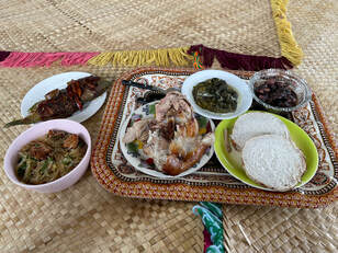 Clockwise from left: Saimin, fish, taro, pulasami (taro leaves in coconut milk), pork and chicken, octopus.