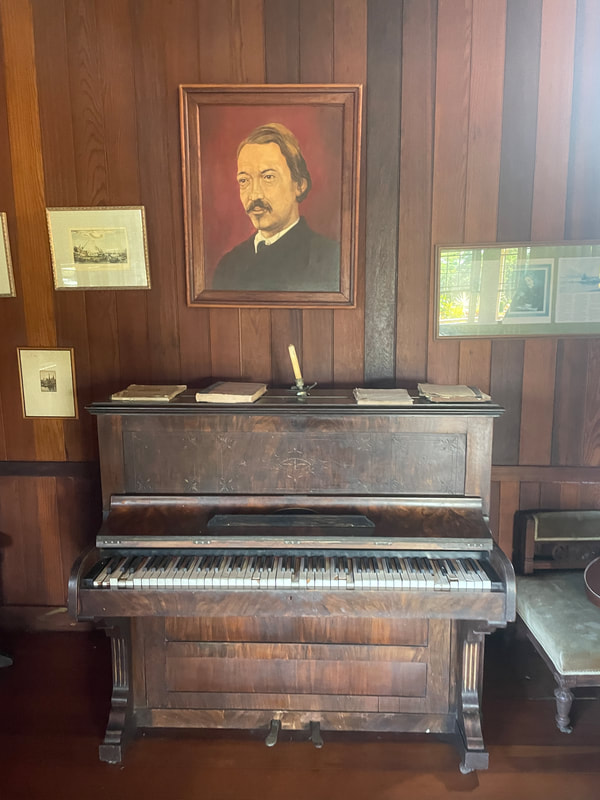 A period-representative piano and another cool painting.